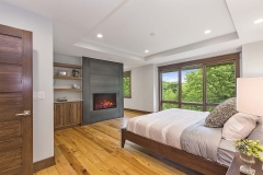 Modern fireplace in new master bedroom with room to sit by the fire