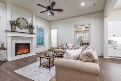 Hardwood flooring and fairly high ceilings give a formal feel in this sitting room